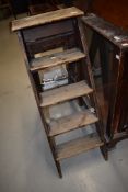 A set of vintage wooden step ladders