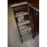 A set of vintage wooden step ladders