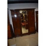 An Edwardian mahogany and inlaid mirror door wardrobe, width approx. 173cm