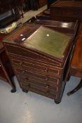 A 19th Century rosewood ladies davenport of compact design having swivel top, and brass gallery