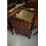 A 19th Century rosewood ladies davenport of compact design having swivel top, and brass gallery