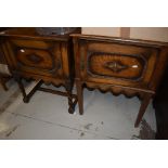 A matched pair of early 20th Century oak bedside pot cupboards, one having twist and one having