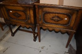 A matched pair of early 20th Century oak bedside pot cupboards, one having twist and one having