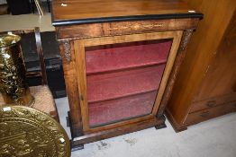 A Victorian empire style display cabinet, having satinwood inlay and brash embelishments, width