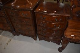 Two reproduction serpentine front bedside or similar drawers