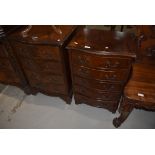 Two reproduction serpentine front bedside or similar drawers