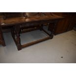 A traditional period oak refectory table having heavy triple plank top on turned legs, dimensions