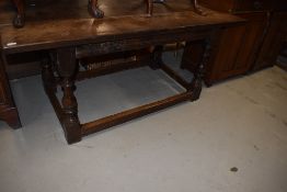 A traditional period oak refectory table having heavy triple plank top on turned legs, dimensions