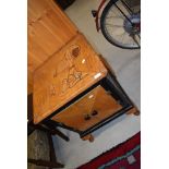 A vintage cabinet having Snoopy and Woodstock marquetry inlay to top