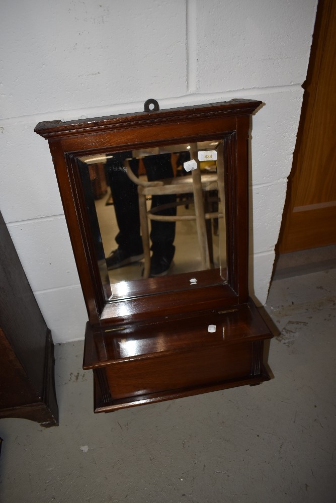 A 19th Century mahogany framed hall mirror having compartmental section with lift flap, approx width