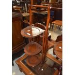 An early 20th Century mahogany folding cake stand