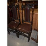 A pair of late 19th or early 20th Century stained frame hall style chairs (please note some evidence