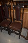 A pair of late 19th or early 20th Century stained frame hall style chairs (please note some evidence