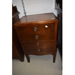 An early 20th Century mahogany four drawer music cabinet