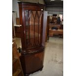 A reproduction Regency mahogany effect corner display