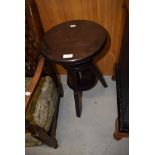 A stained frame adjustable stool