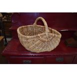 A traditional wicker basket, width approx 55cm