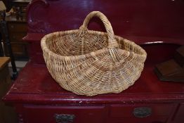 A traditional wicker basket, width approx 55cm