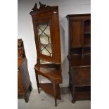 A Victorian oak corner display on stand