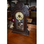 A Victorian stained frame American style mantel clock