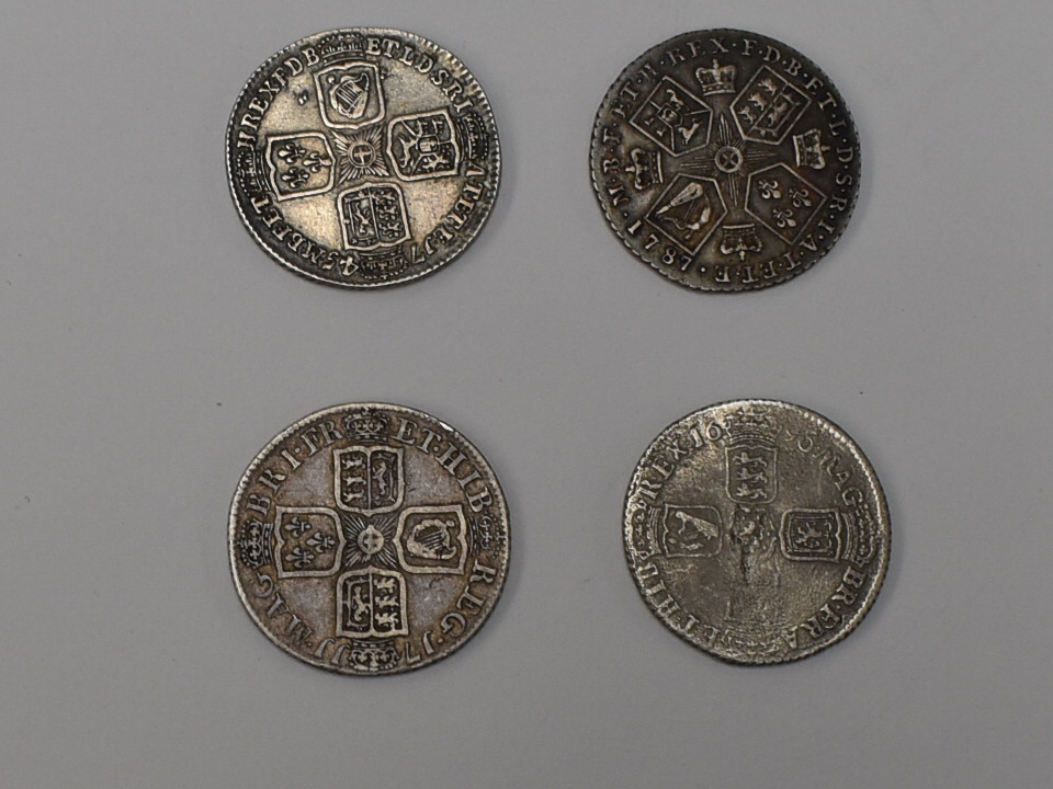 Four One Shillings Silver Coins, George II 1745 Lima under bust, George III 1787, William III 1696B,