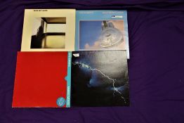 A lot of four original Dire Straits vinyl albums