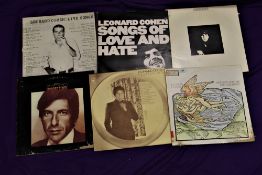A lot of six albums by Leonard Cohen