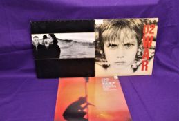 A lot of three albums by U2