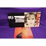 A lot of three albums by U2