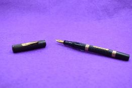 A Watermans Ideal Leverfill fountain pen in chased HBR, with band to top and bottom of barrel,