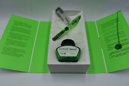 A Pelikan M205 green highlighter fountain pen, boxed with bottle of highlighter ink