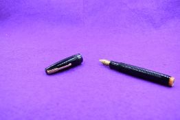 A Watermans Hundred Year leverfill fountain pen in Black hooped with single broad band to cap and