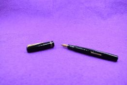 A Mabie Todd & Co Swan 6260 Self filler leverfill fountain pen in black with two narrow gold band to