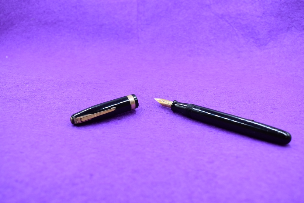 A Watermans 515 leverfill fountain pen in Black with broad band with Watermans Ideal nib. Approx