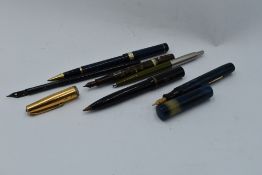 A selection of fountain pens and ball point pen, including Waterman's brown marble, leverfill with