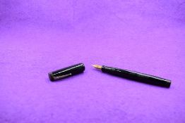 A Mabie Todd & Co Swan Leverless twist filler, in black and a Phillips, Oxford nib. Approx 12.7cm