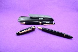 A Montblanc Meisterstruck 146 vacuum fill fountain pen and ballpoint set in black with one broad