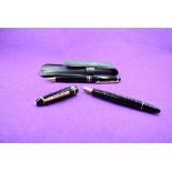 A Montblanc Meisterstruck 146 vacuum fill fountain pen and ballpoint set in black with one broad