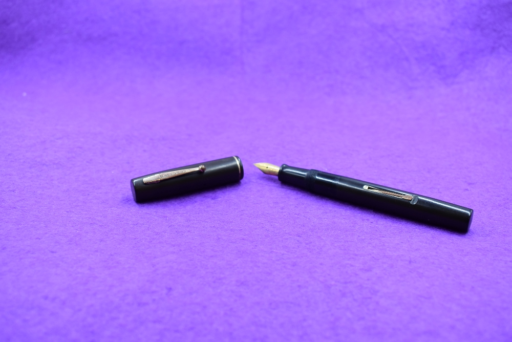 A Watermans Ideal leverfill fountain pen in black with single narrow band to cap and a Watermans