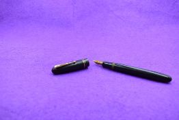 A Mabie Todd & Co Swan 6261 Self Filler Leverfill, in black with two bands to the cap and a Swan No2