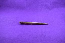 A Mabie Todd Co Ltd Fyne Poynt gold propelling pencil. Stamped .585