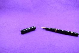 A Mabie Todd & Co Blackbird Self filler Leverfill fountain pen, in BHR with band to top and bottom
