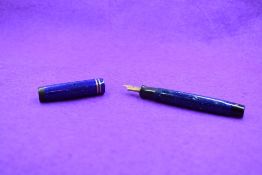 A Parker Duofold button fill fountain pen in blue marble with two narrow bands to cap and Parker