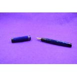 A Parker Duofold button fill fountain pen in blue marble with two narrow bands to cap and Parker