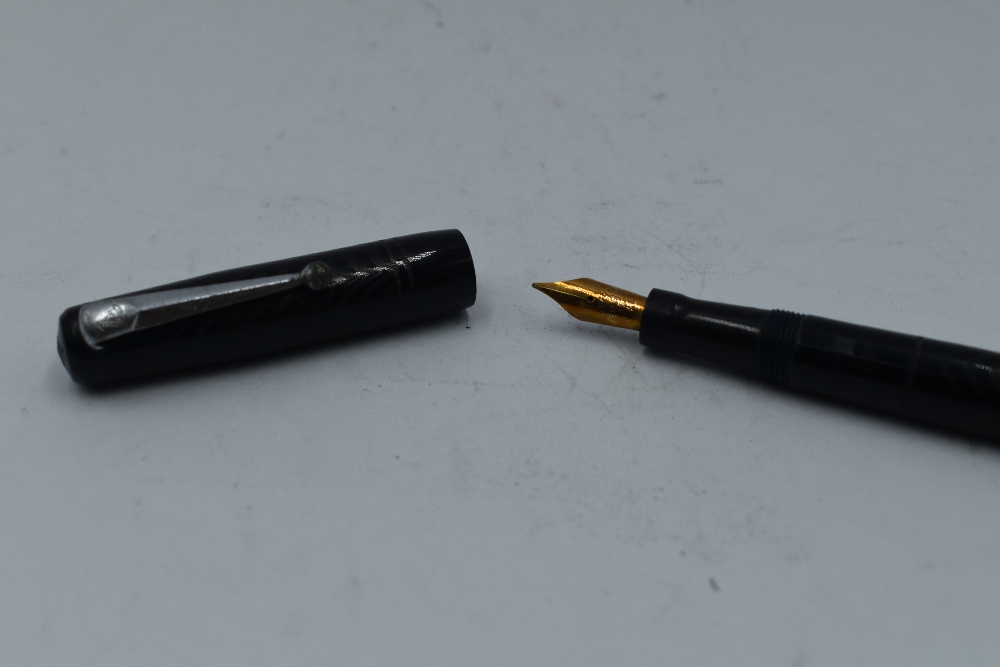 A Mabie Todd & Co Self filler leverfill fountain pen in black with chased design with Warrented 14ct - Image 2 of 2