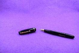 A Mabie Todd & Co Swan 3260 Self Filler Leverfill, in black with two bands to the cap and a Swan No2
