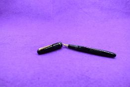 A Mabie Todd & Co Swan 3160 Self filler leverfill in black, single band to cap, with Swan No1 nib.