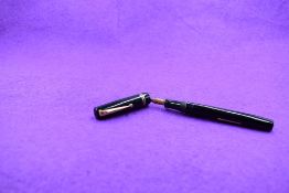 A Mabie Todd & Co Swan 6260 Self Filler Leverfill, in black with two bands to the cap and a Swan No2