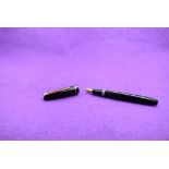 A Mabie Todd & Co Swan Leverless twist filler, in black with a single band to cap and a Swan No2