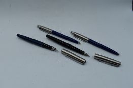 Two modern Parker fountain pens, a Parker mechanical pencil and a Parker ballpoint